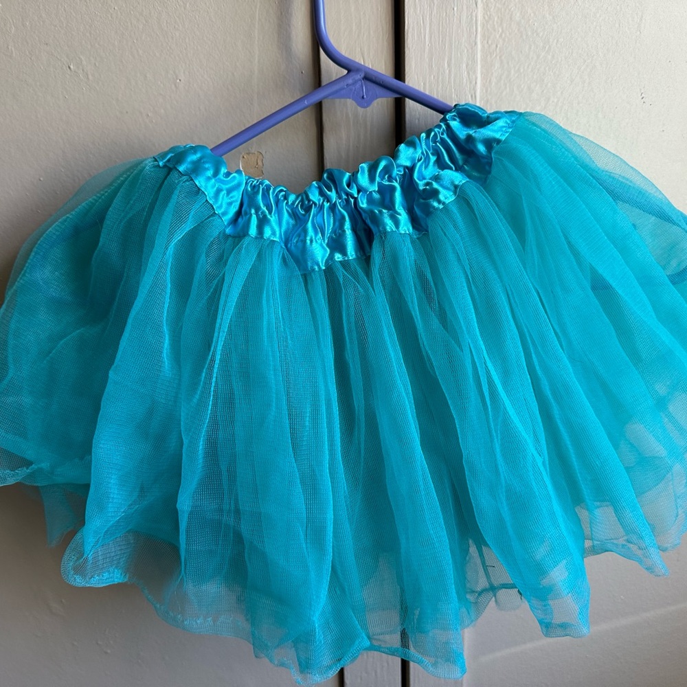 OS Turquoise Tutu Waist is 6” and stretches to 17” length is 11” top to bottom